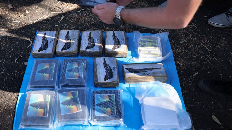 Police officers collecting evidence on a drug trafficking ring dubbed "The Commission". AFP/New South Wales Police