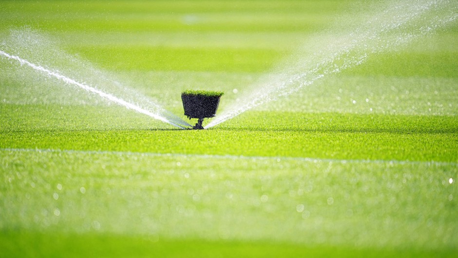 File: A water sprinkler spraying water. Michael Kappeler/dpa Picture-Alliance via AFP