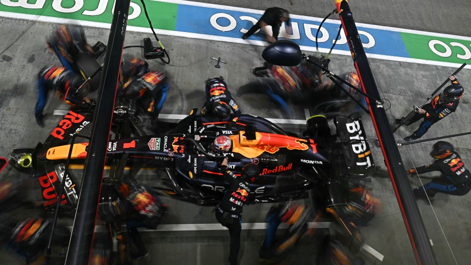 Team mechanics work on the car of Red Bull Racing's Dutch driver Max Verstappen in the pits. AFP/Lilian Suwanrumpha
