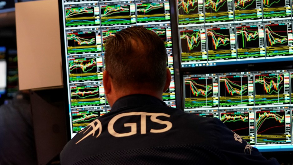 A trader works on the floor at the closing bell t the New York Stock Exchange. AFP/Timothy A Clary