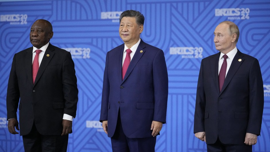 File: South African President Cyril Ramaphosa, Chinese President Xi Jinping and Russian President Vladimir Putin pose for a family photo during the BRICS summit in Kazan on October 23, 2024.
