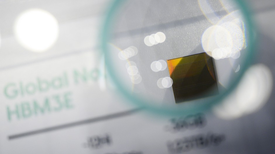 A display for South Korean chip giant SK Hynix's 16-layer HBM3E chip. AFP/Anthony Wallace