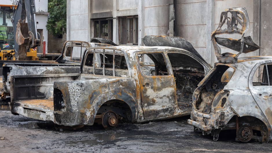 File: A general view of the rubble of three cars that were burned inside the offices of the Mozambique Liberation Front party (FRELIMO) in the Maxaquene neighbourhood of Maputo on November 8, 2024, following clashes between protesters and riot police the previous day. 