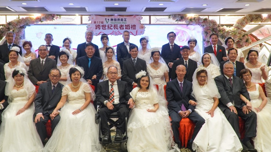 Couples posing for a group wedding photo in a restaurant in Hong Kong. AFP/Jaixin Lu