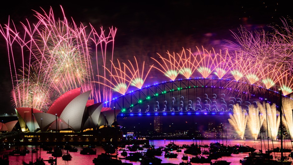 File: Fireworks are lighting up the sky over the Sydney Harbour Bridge and the Sydney Opera House during New Year's Eve celebrations. Izhar Khan/NurPhoto via AFP