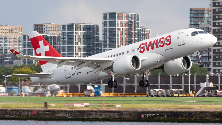 File: A Swiss Airlines Airbus A220 is landing at London City Airport in London. MI News/NurPhoto via AFP