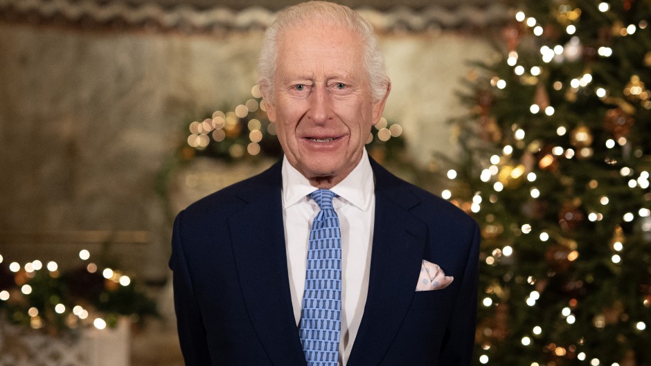 Britain's King Charles III smiles during the recording of his Christmas message. AFP/Aaron Chown