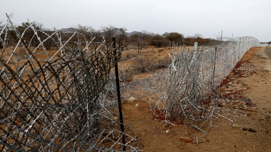 File: A vandalised border fence that separates South Africa and Zimbabwe where near the Beitbridge border post. AFP/Phill Magakoe