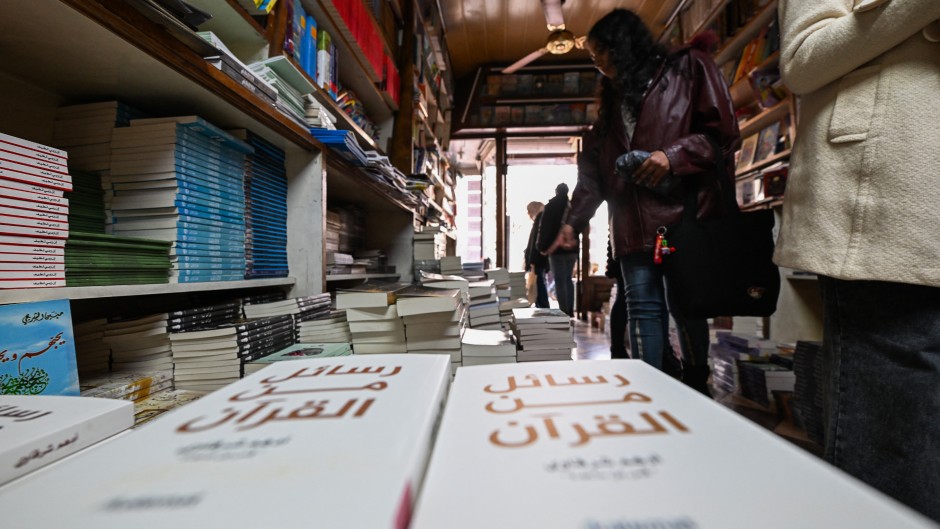 People browse publications at a bookshop in Damascus. AFP/Louai Beshara