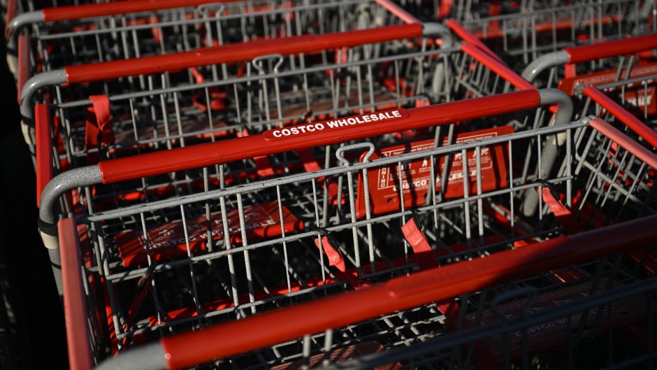 The Costco logo is displayed on shopping carts at a Costco Wholesale warehouse store. AFP/Patrick T Fallon