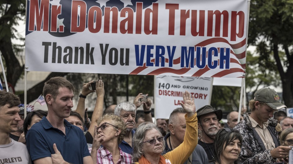 South Africans supporting US President Donald Trump and South African and US tech billionaire Elon Musk gather in front of the US Embassy in Pretoria. AFP/Marco Longari