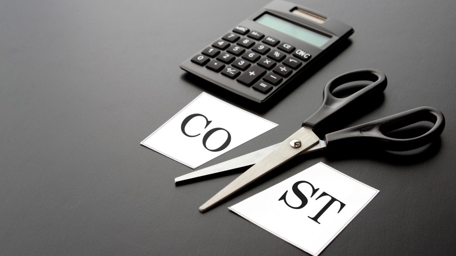 File: Cost-cutting with a calculator. GettyImages/takasuu