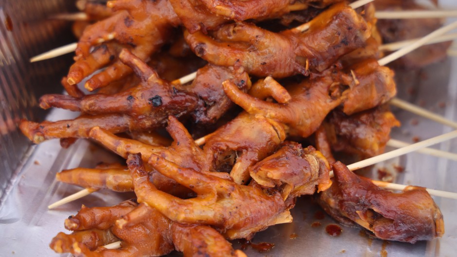 Chicken feet are being displayed at a food stall. Creative Touch Imaging Ltd/NurPhoto via AFP