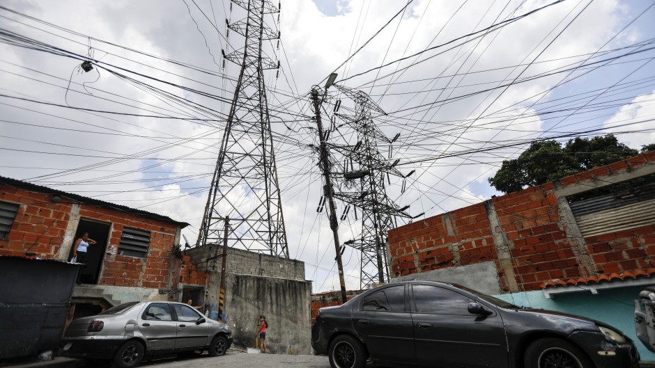 High-voltage towers with irregular electrical connections are seen in Catia. AFP/Pedro Rances Mattey