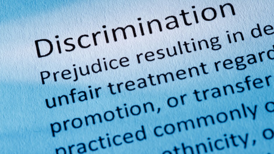 The word discrimination seen in a dictionary. GettyImages/nigelcarse