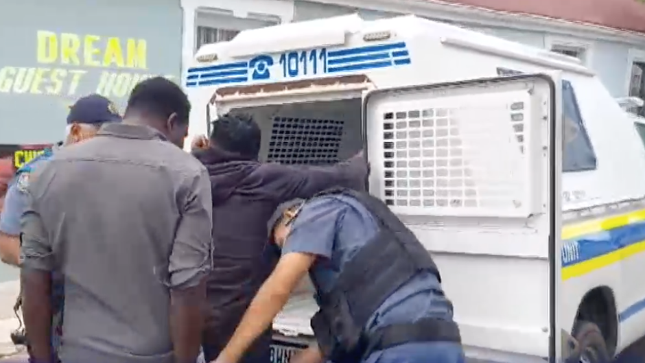 Police officers arresting suspects in Gqeberha.