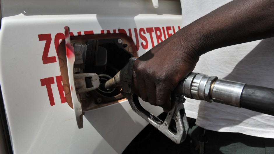 File: A resident fills his car with fuel at a gas station in Bamako. AFP/Issouf Sanogo