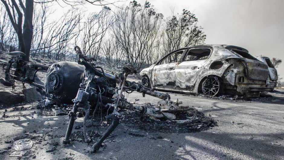 Cars and a motorbike were burnt out at Sivermine dam parking area during a raging fire at Table Mountain National Park. Gallo Images/Brenton Geach