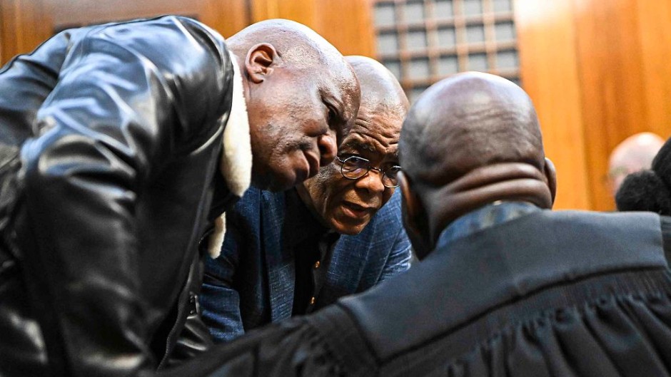 Ace Magashule speaks to a legal representative at Bloemfontein High Court. Mlungisi Louw/Volksblad/Gallo Images via Getty Images
