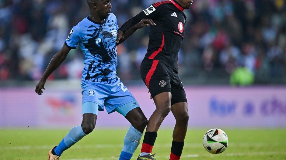 Patrick Maswanganyi of Orlando Pirates challenged by Lehlohonolo Mtshali of Magesi FC. BackpagePix/Alche Greeff
