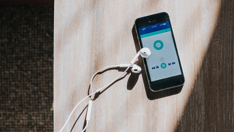 A cellphone displaying a generic music type app. GettyImages/Catherine Falls Commercial