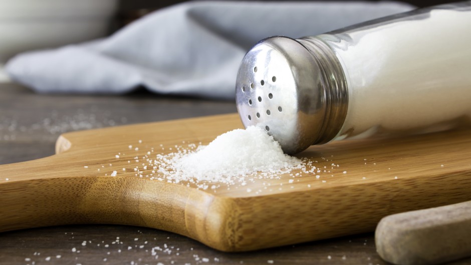 Salt spilling out of a salt shaker. GettyImages/Synergee