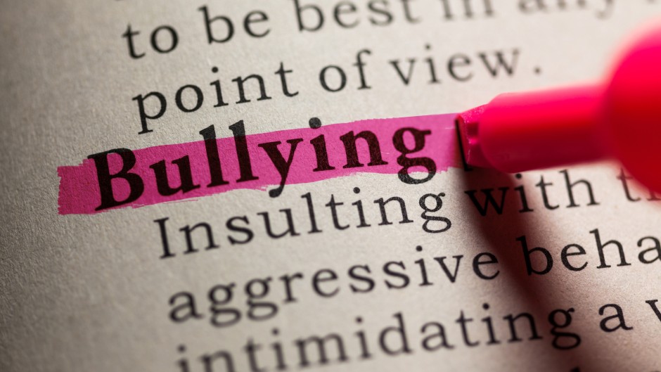 The word 'bullying' in a dictionary. GettyImages/Devonyu