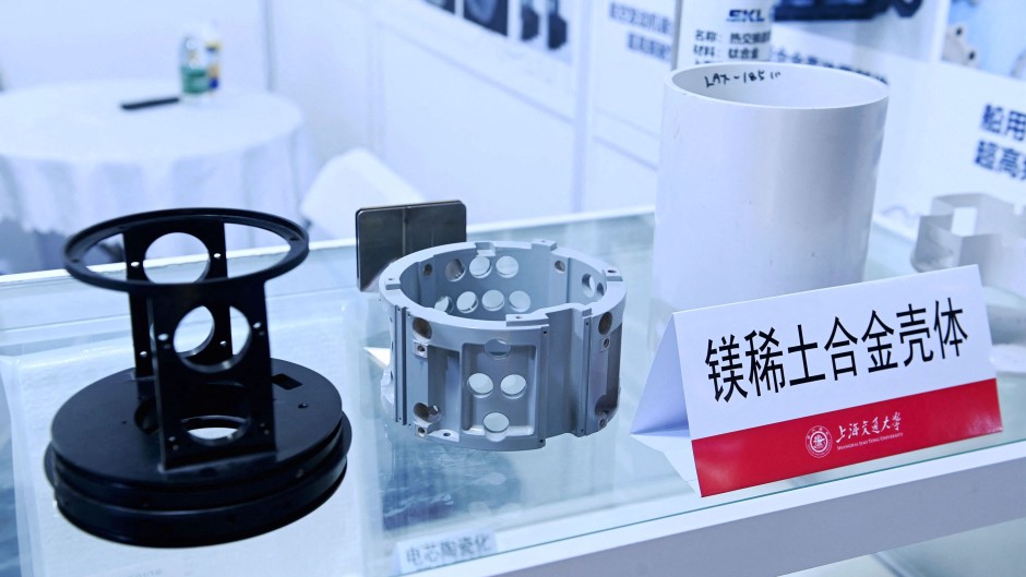 An exhibitor displays magnesium rare earth alloy materials. Costfoto/NurPhoto via AFP