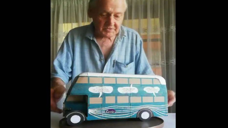 Artist, John Fann with one of his buses created from cereal boxes