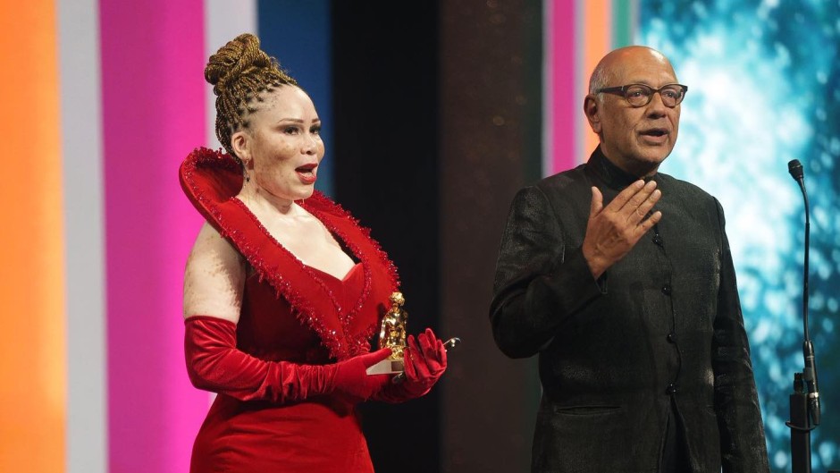 Lelelti Khumalo and Anant Singh receive an award at the Monte Carlo Television Festival