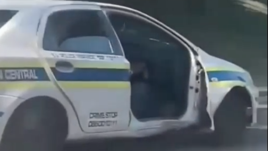 The police vehicle without a door.