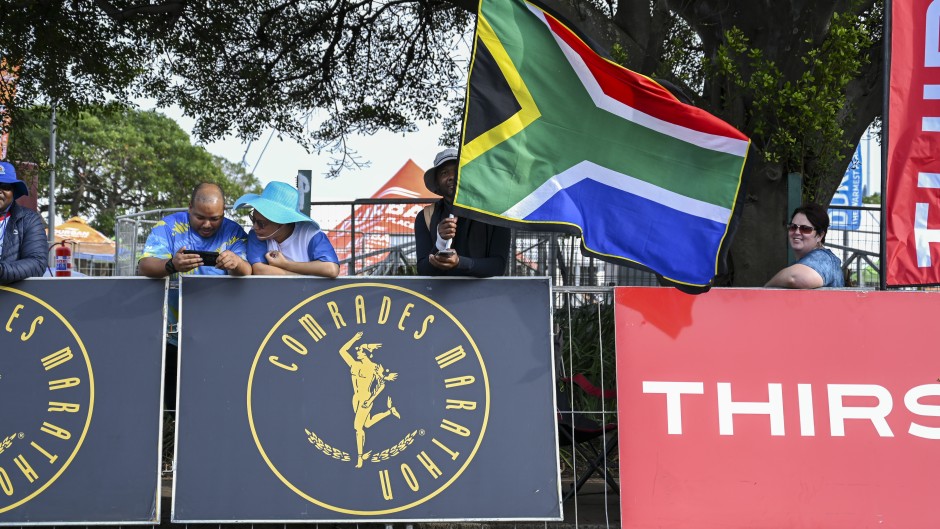 Fans with flags during the 2025 Comrades Marathon. Darren Stewart/Gallo Images