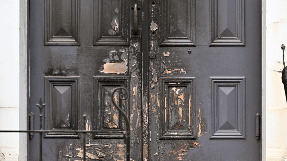 A photo shows the burnt front entrance of the East Melbourne Synagogue in Melbourne. AFP/William West