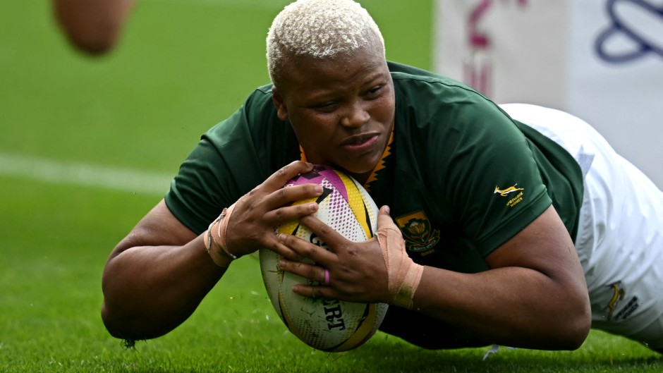 South Africa's Aseza Hele scores a try during the Women’s Rugby World Cup pool D match. AFP/Paul Ellis