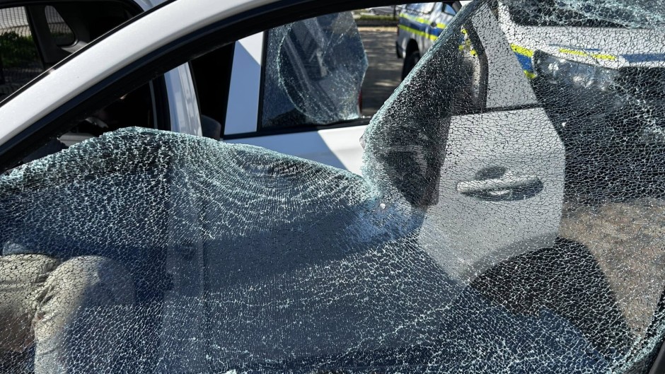 Shattered window of a vehicle Ian Cameron, Nicholas Gotsell and Lisa Schickerling were travelling in when they were attacked in Philippi, Western Cape 