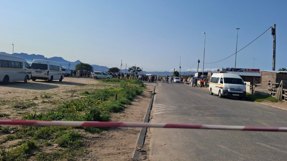 Police on the scene of the shooting at Macassar taxi rank. eNCA/Nobesuthu Hejana