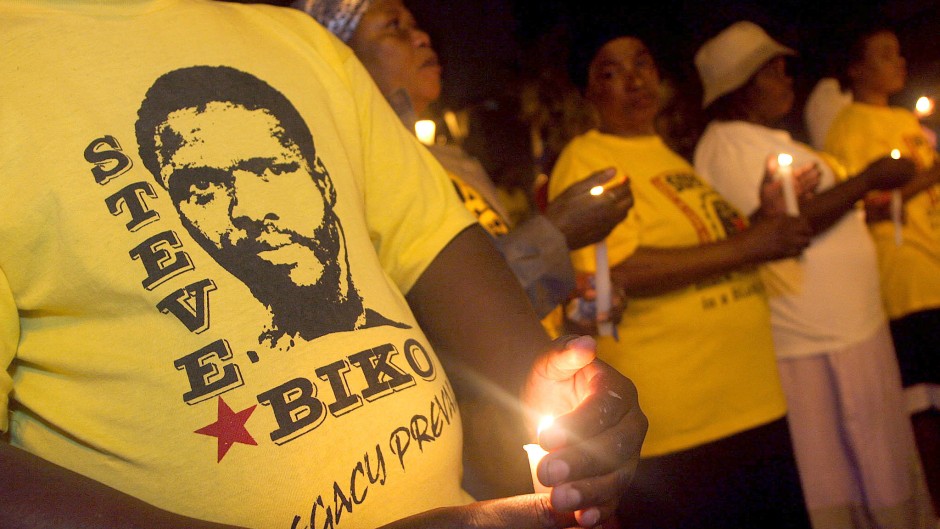 File: Members of SOPA hold a candlelight memorial to mark the death anniversary of the anti-apartheid activist Steve Biko. AFP/Rajesh Jantilal