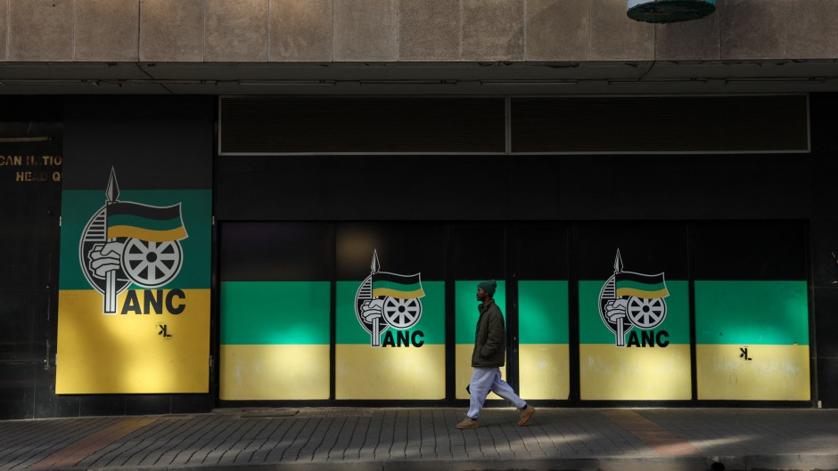 A man walks past Chief Albert Luthuli House, ANC headquarters in Johannesburg. AFP/Phill Magakoe