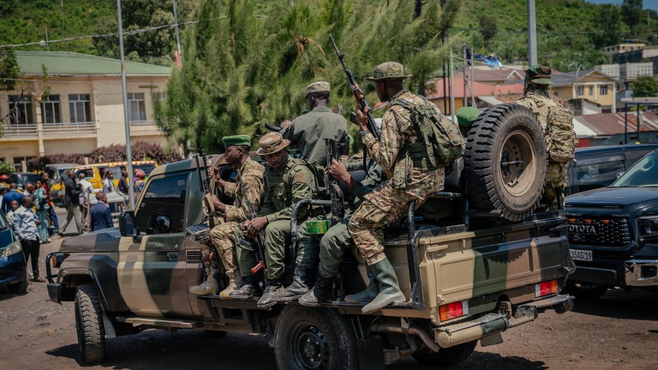 File: M23 rebel soldiers board pickup trucks in Goma. AFP/Jospin Mwisha