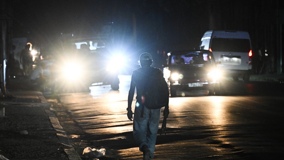 A man walks in the street during a power outage in Havana. AFP/Yamil Lage