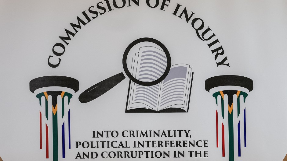 A general view of a logo of the Commission of Inquiry into criminality, political interference and corruption in the criminal justice system. AFP/Phill Magakoe