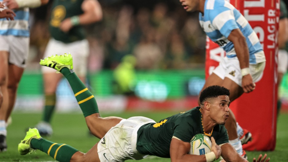South Africa's fly-half Sacha Feinberg-Mngomezulu dives to score a try during the Rugby Championship Test match between South Africa and Argentina at Kings Park Stadium in Durban on September 27, 2025. 