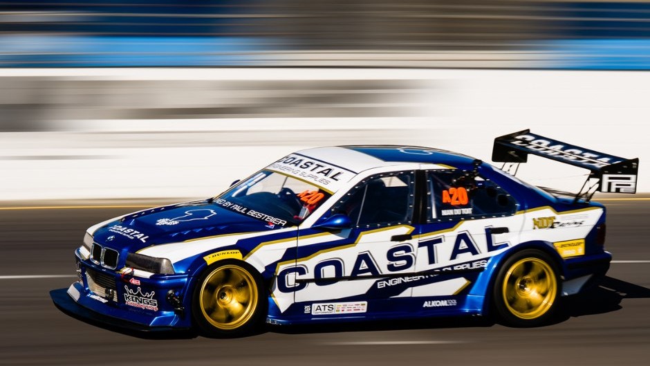 A motorsport vehicle dashes on a race course