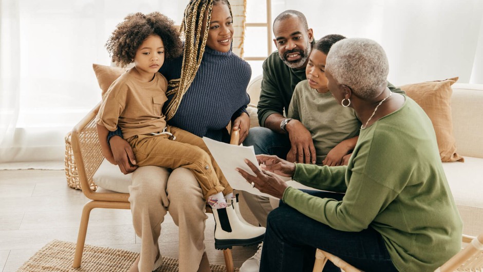 mixed family looking at documents