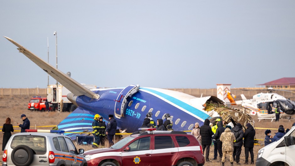 Emergency specialists work at the crash site of an Azerbaijan Airlines passenger jet near the western Kazakh city of Aktau on December 25, 2024.
