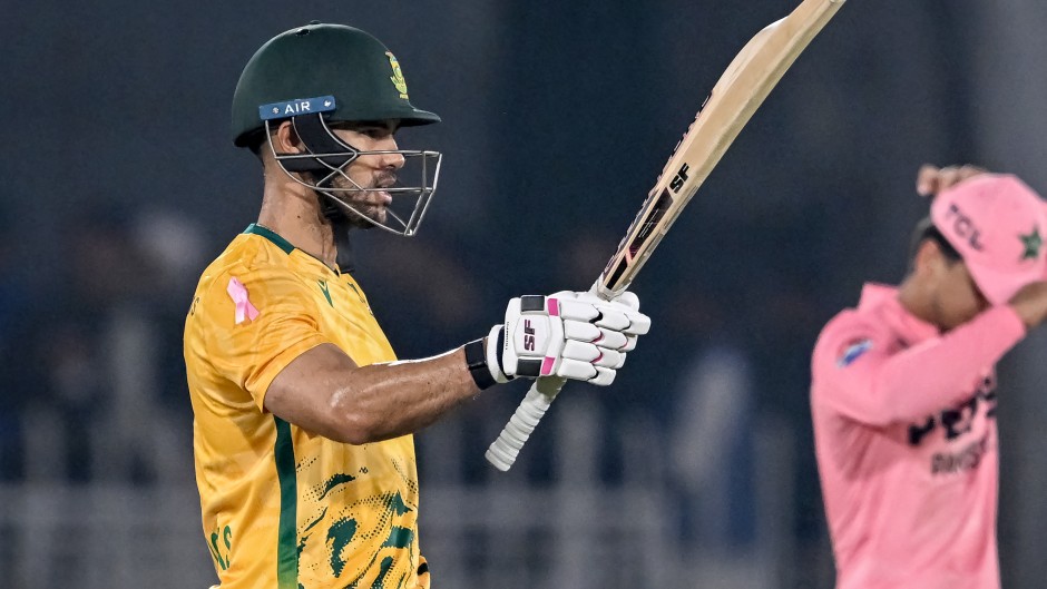 Reeza Hendricks celebrates after scoring a half-century. AFP/Farooq Naeem