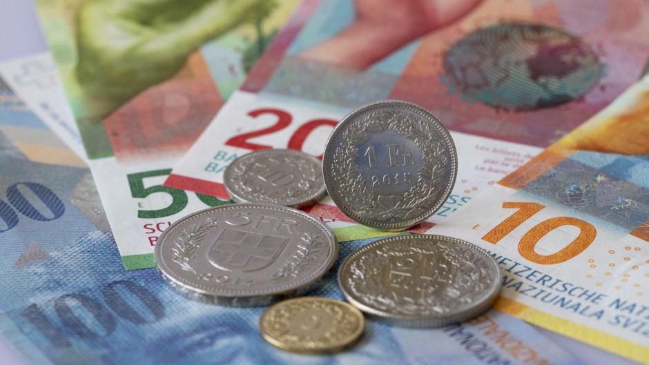 Swiss franc banknotes and coins. Robert Schmiegelt/Geisler-Fotopr/dpa via AFP