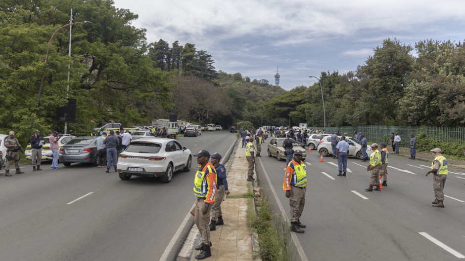 File: JMPD officers stop vehicles at a roadblock. AFP/Guillem Sartorio