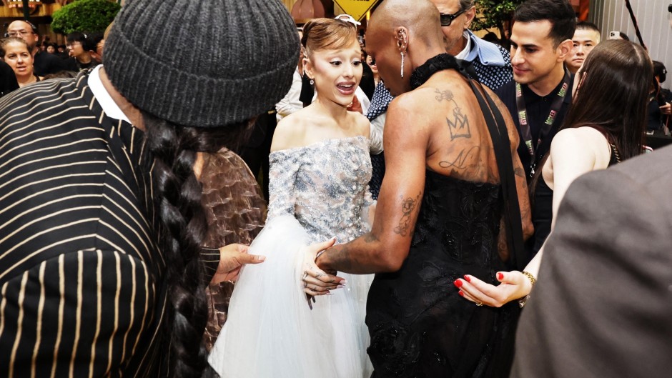 Ariana Grande (C) and Cynthia Erivo (2nd R) at the premiere of their film "Wicked: For Good" in Singapore. AFP/STR