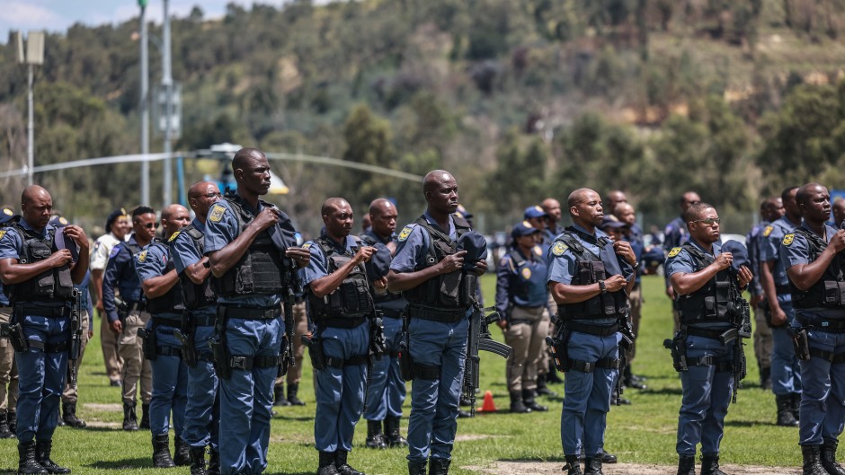 Members of the South African Police Service (SAPS) stand at attention during the Integrated Law Enforcement parade near the Nasrec Expo Centre in Johannesburg, on November 19, 2025.